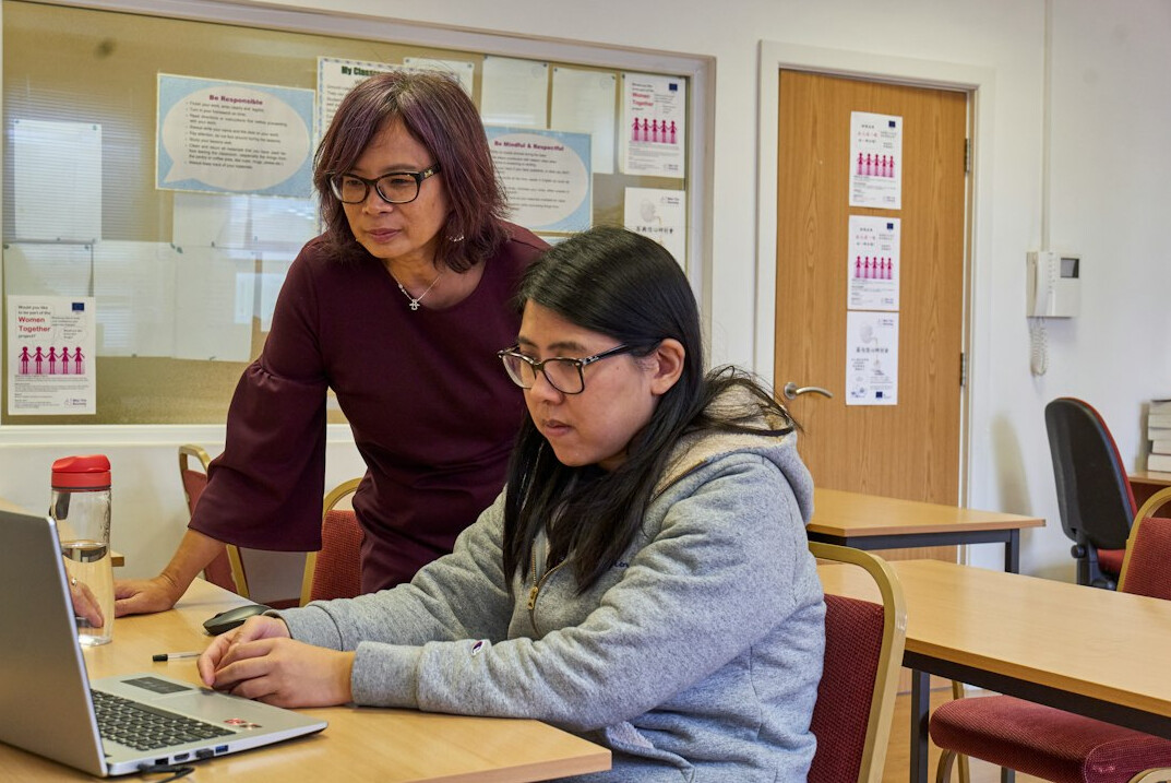 mentor guiding student in programming